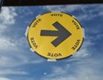 A sign points the way to a polling station