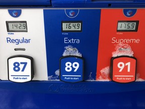 Gas prices are displayed at an Esso station in Oakville, Ont.