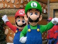 Mario and Luigi wave to the guests during a preview of Super Nintendo World at Universal Studios in Los Angeles, on Jan. 13, 2023.