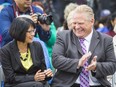 From left, Olivia Chow and Doug Ford, then mayoral candidates, are seen during the CARP Flag Raising Ceremony in honour of National Seniors Day at Toronto City Hall on October 1, 2014.