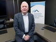 Peter Squire, vice-president of external relations and market intelligence for the Winnipeg Real Estate Board, poses for a photograph at the WREB office on Portage Avenue in Winnipeg on Monday, Jan. 31, 2022.